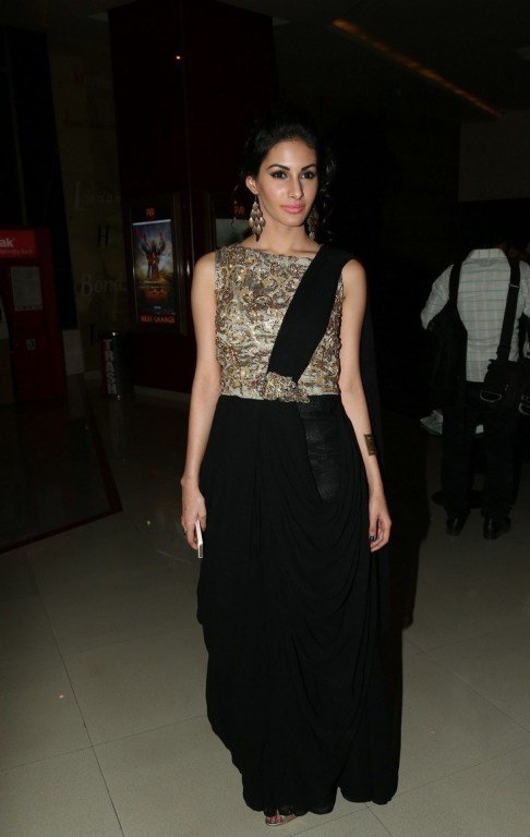 Amyra Dastur in black and golden dress.