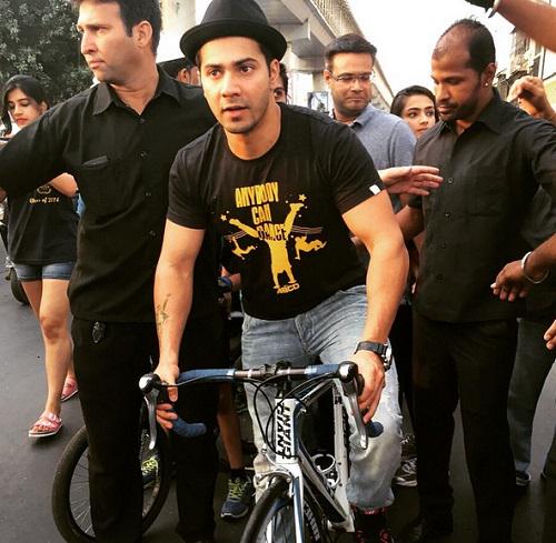 Varun Dhawan riding bicycle