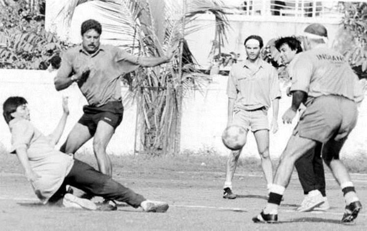 Rare picture of Shah Rukh Khan and Kapil Dev playing football.