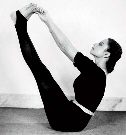 Rekha practices yoga