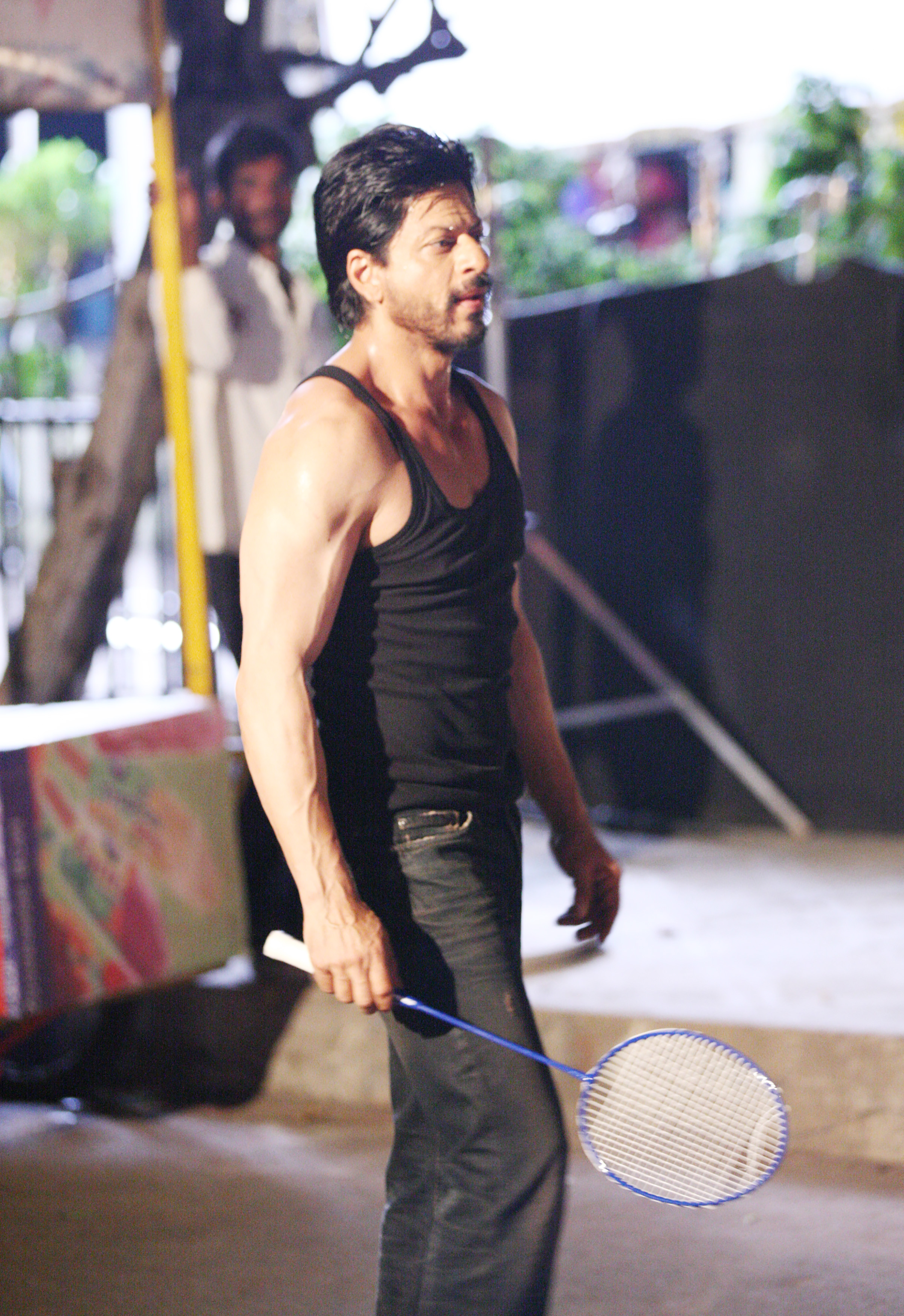 Shah Rukh Khan playing badminton