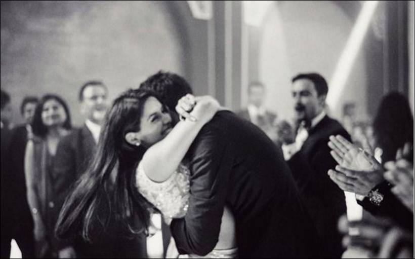 Asin and Rahul Sharma sharing a hug