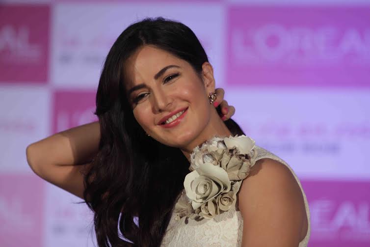 A smiling Katrina Kaif in white at lipstick launch