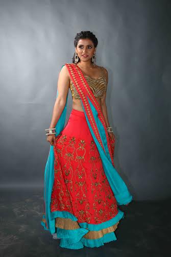 Mannara Chopra posing in pink and blue traditional outfit