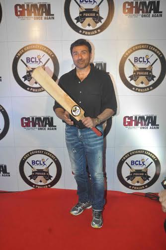 Sunny Deol in black shirt with a bat in hand