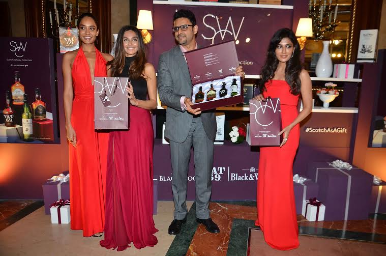 Chitrangda Singh, Lisa Haydon, Shibani Dandekar posing with the gift collection at the launch of Diageo's Scotch Whiskey Gift Collection,
