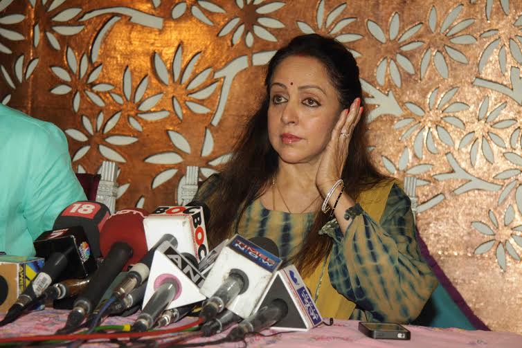 Hema Malini paying attention to the questions put forth by the media