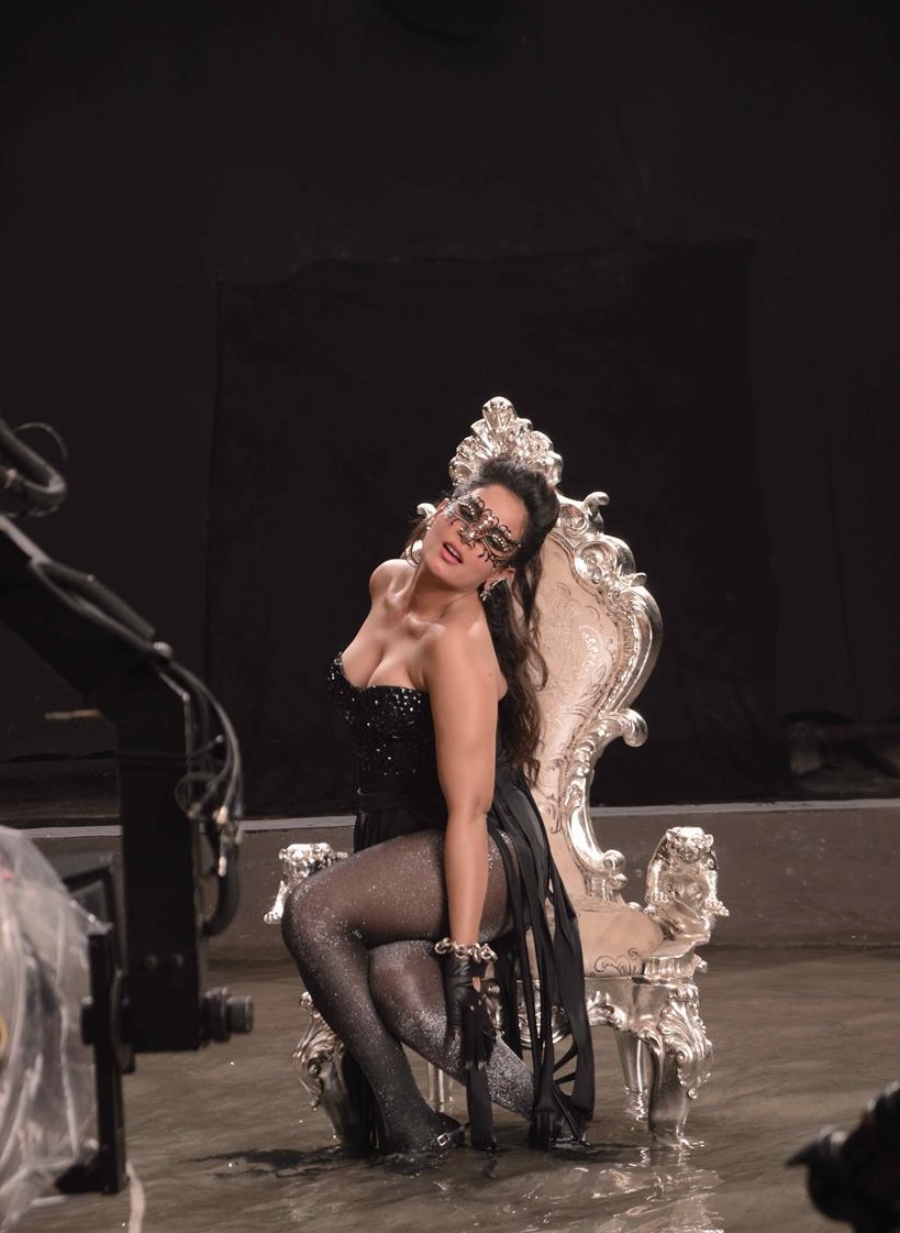 Richa Chadda striking a pose in a black dress on cabaret sets