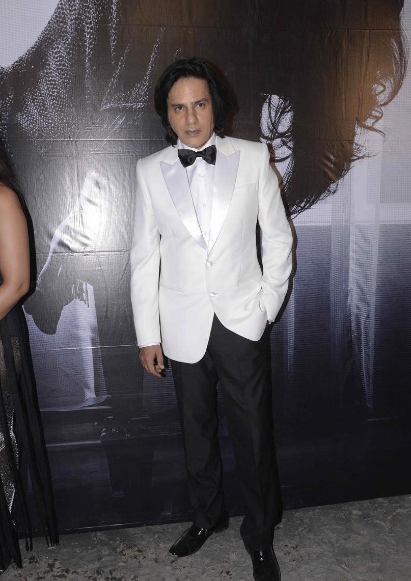 Rahul Roy in white and black on Cabaret sets