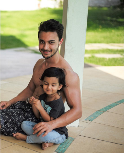 Aayush Sharma with a child