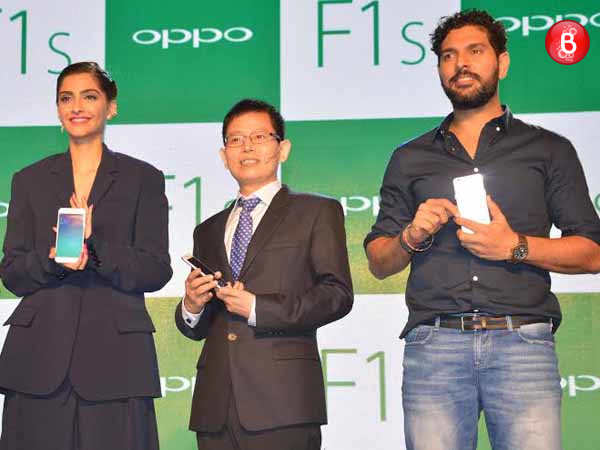 Actress Sonam Kapoor, Sky Li, Global VP, MD of International Mobile Business and President of Oppo India and Indian cricket player Yuvraj Singh