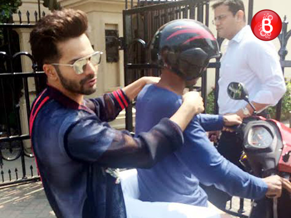 Varun Dhawan is snapped while taking a lift on a scooty