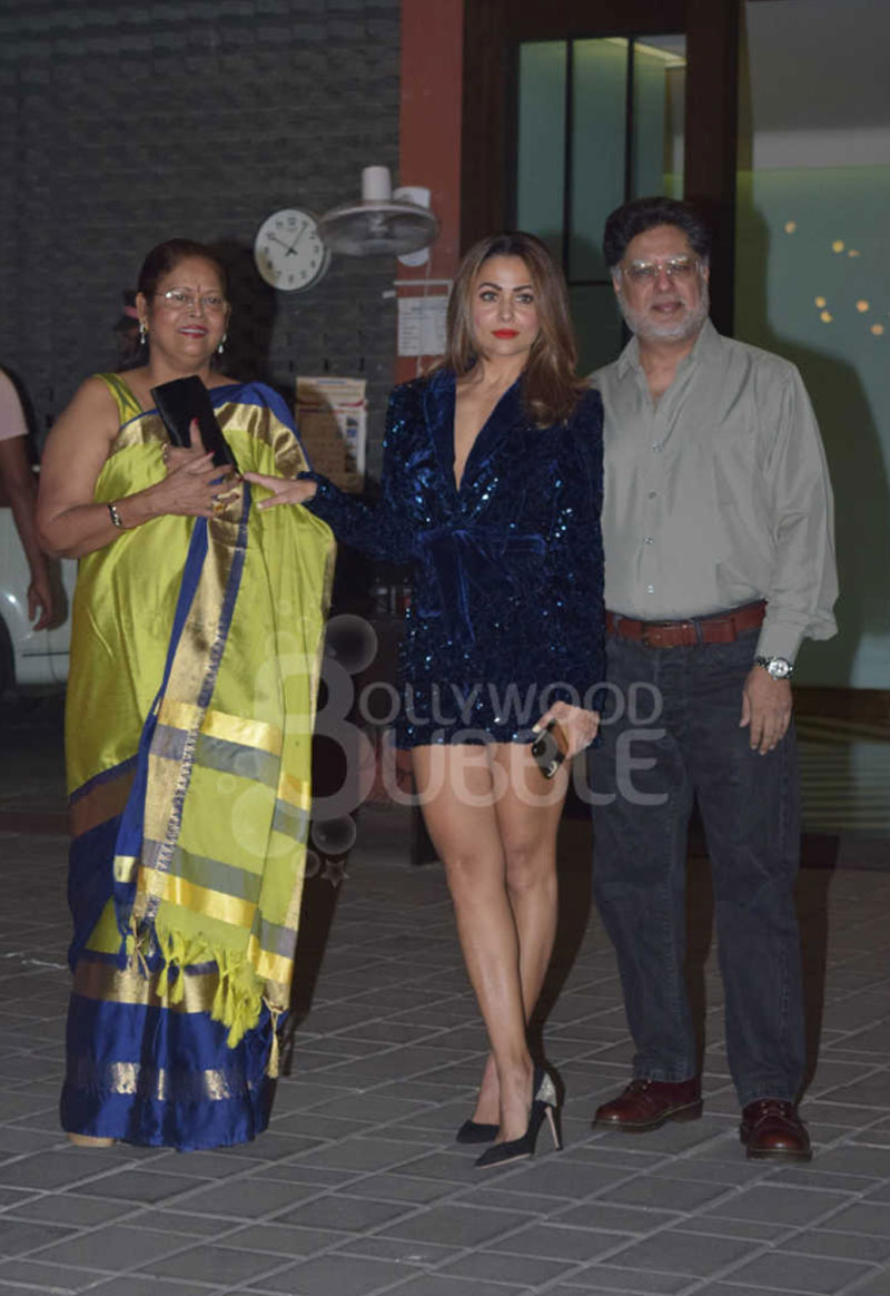 Amrita Arora with her parents