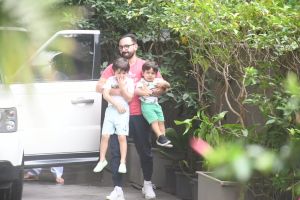 Saif Ali Khan holds sons Taimur & Jeh in each arm as he heads out with ...