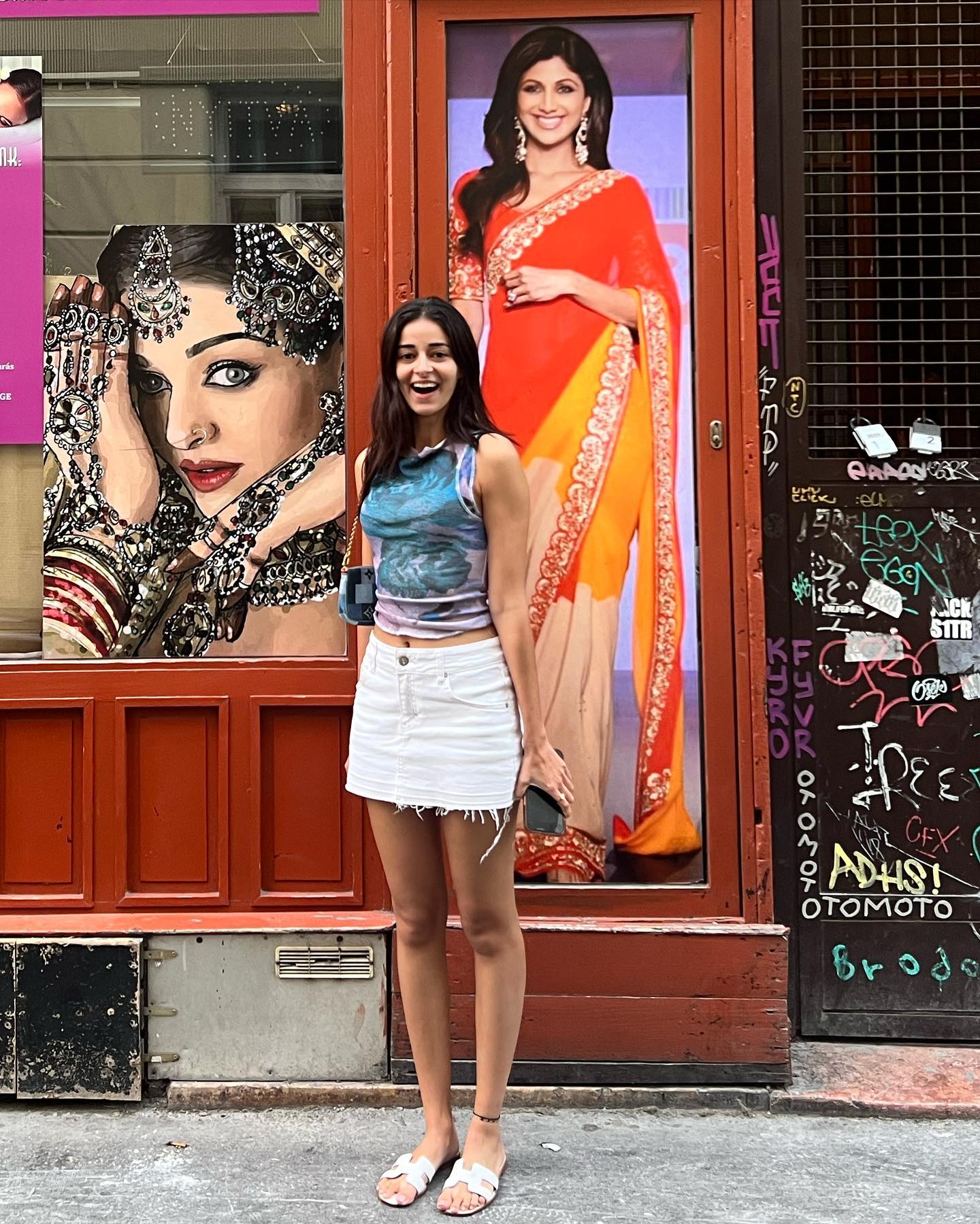 Ananya Panday is all smiles as she poses amid the posters of Shilpa Shetty and Aishwarya Rai Bachchan in Budapest