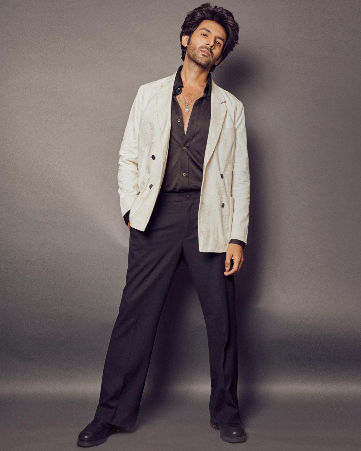 Birthday boy Kartik Aaryan looking dapper in a black and cream suit