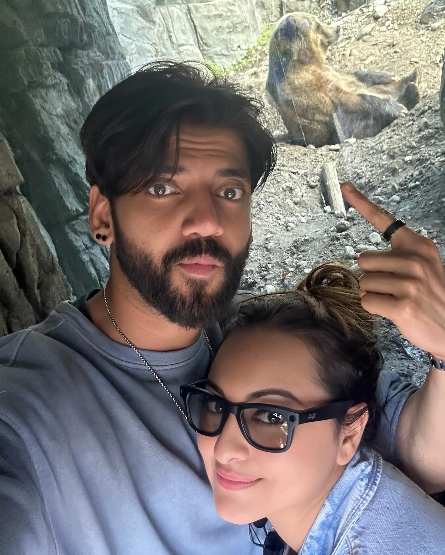 Sonakshi Sinha and Zaheer Iqbal posing with the bear