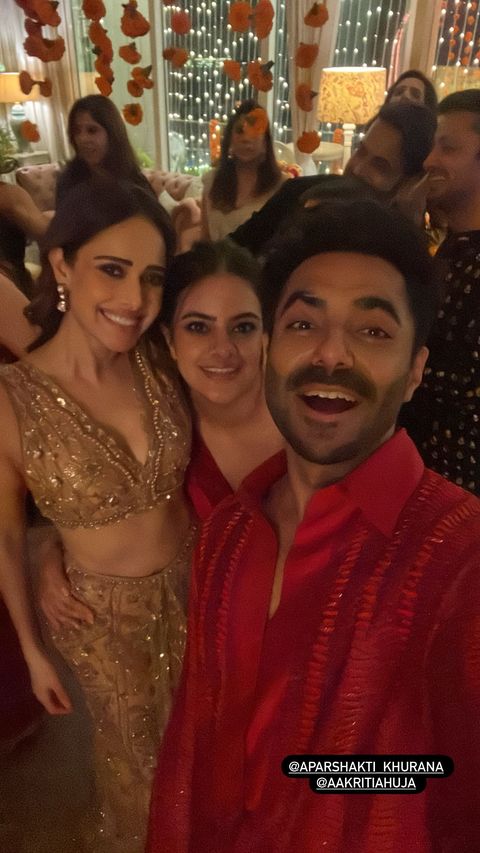 Nushratt poses with Aparshakti Khurrana