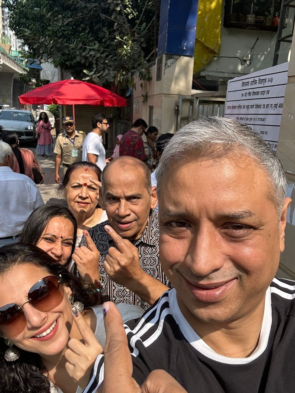 Vidya Balan poses with family after voting